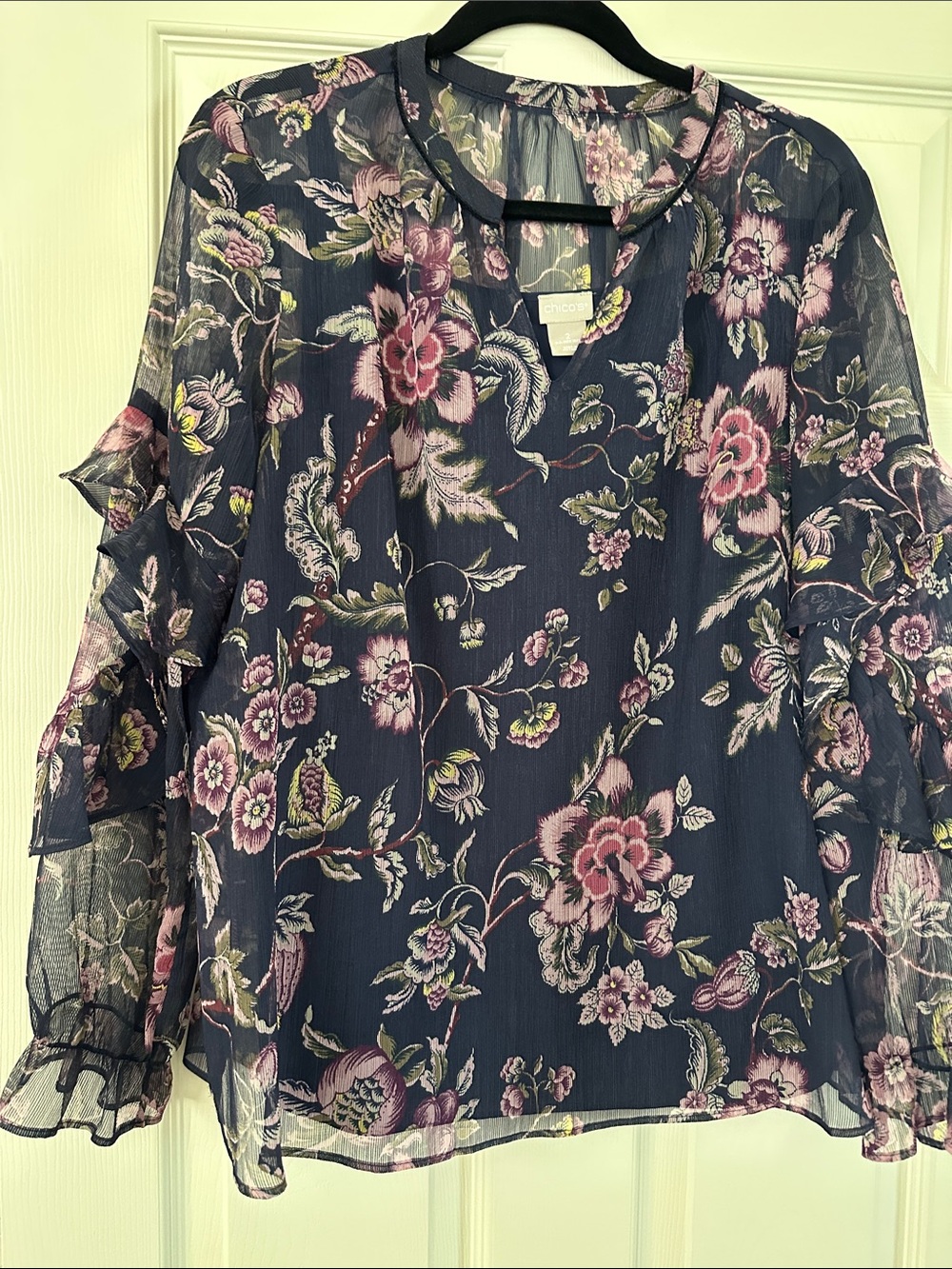 Navy floral with ruffle detail on the blouse